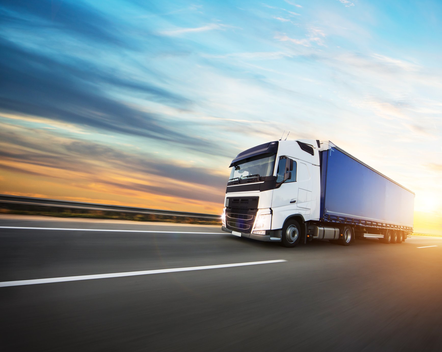 Loaded European Truck on Motorway in Sunset